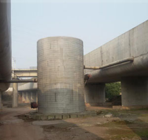Corrugated metal water storage tank on TongHe express way